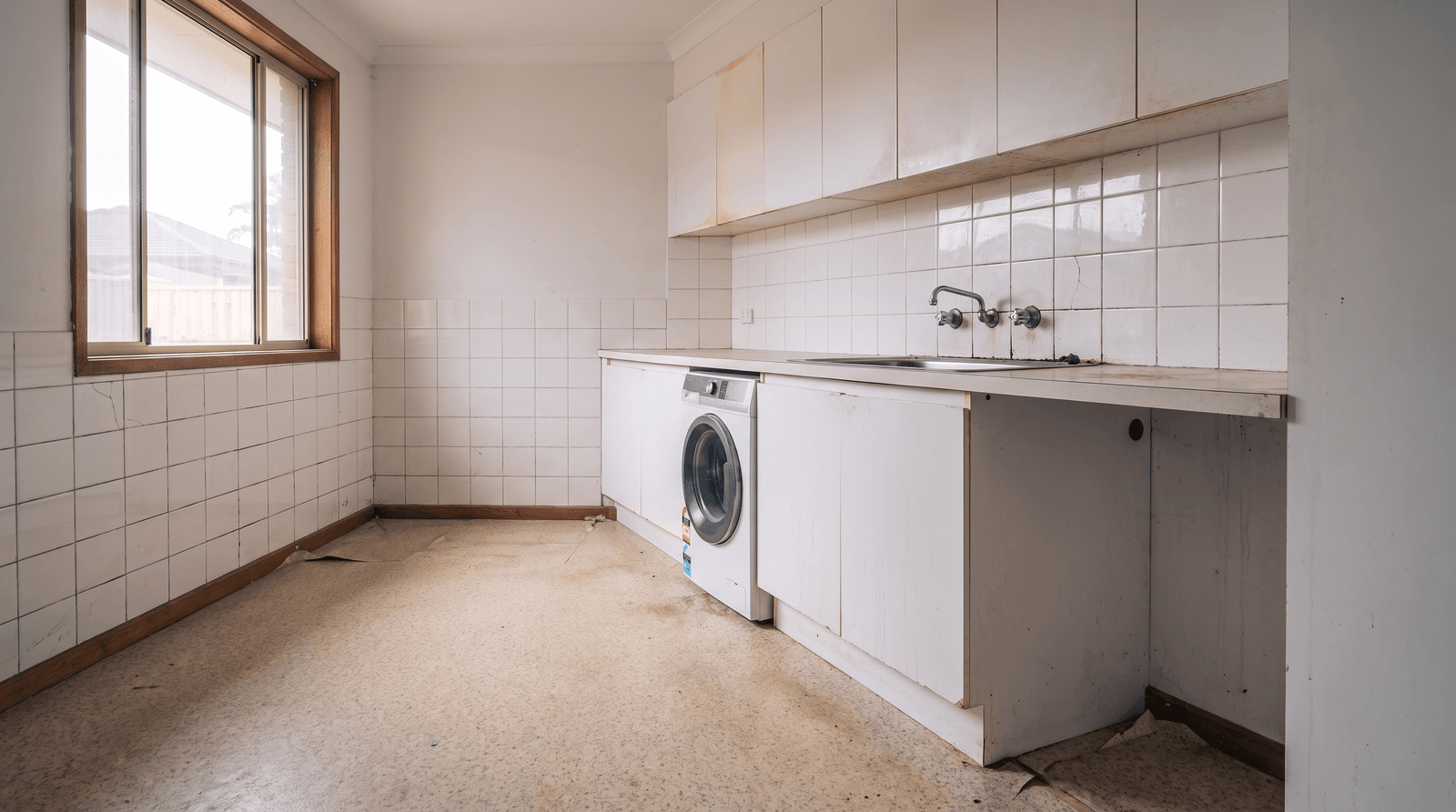 Laundry and bathroom combine before
